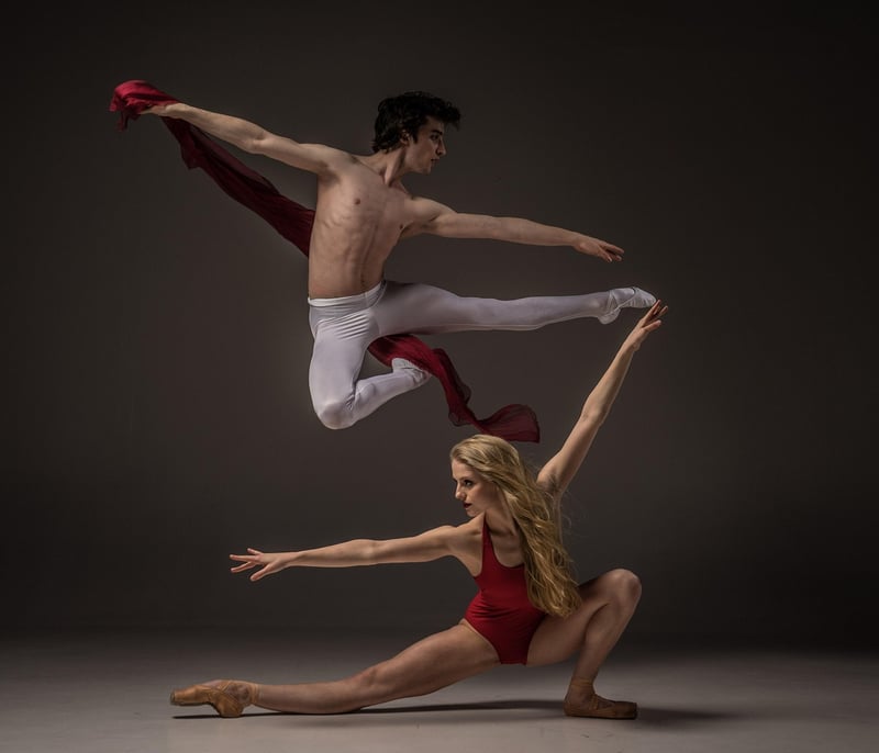 Two dancers in red costumes